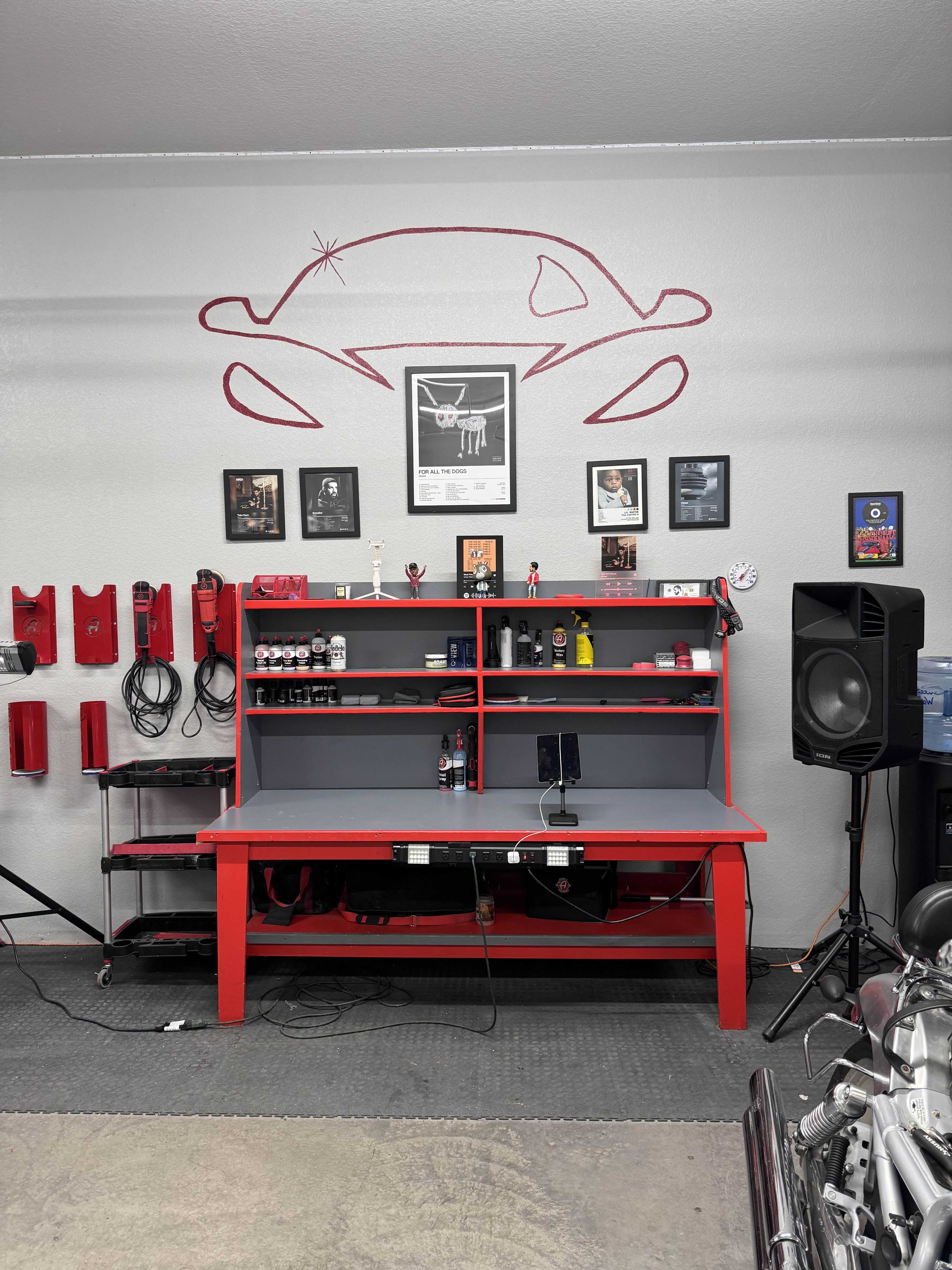 Professional detailing workbench with equipment wall display