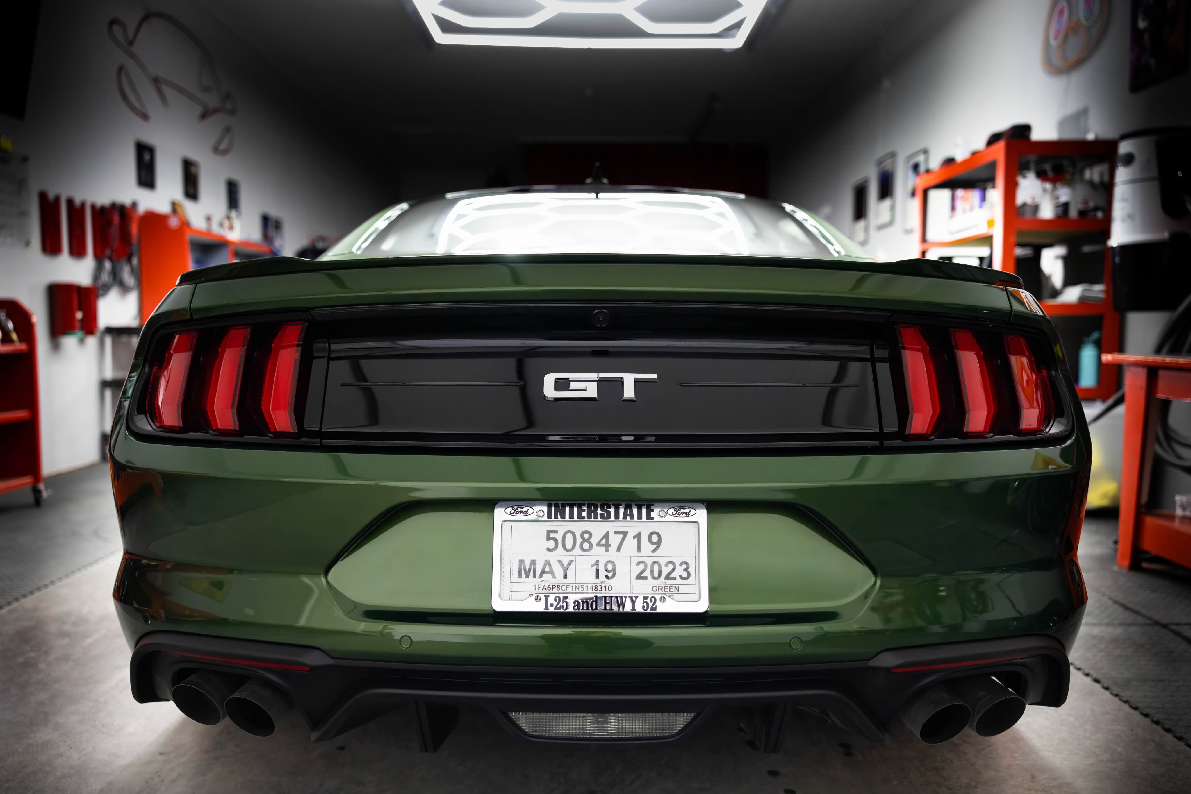 Green Mustang GT rear view in detailing studio